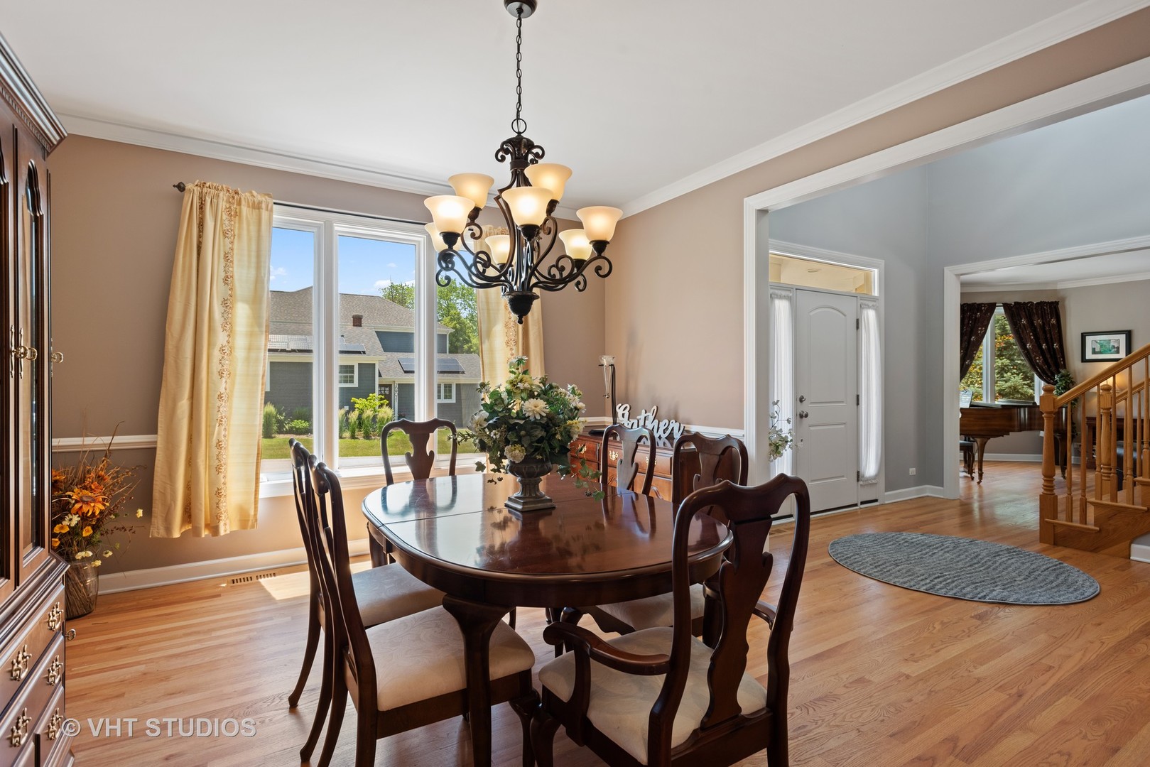 N210 Silverleaf Boulevard Wheaton, IL 60187 - Photo 12 of 48 a view of a dining room with furniture and wooden floor