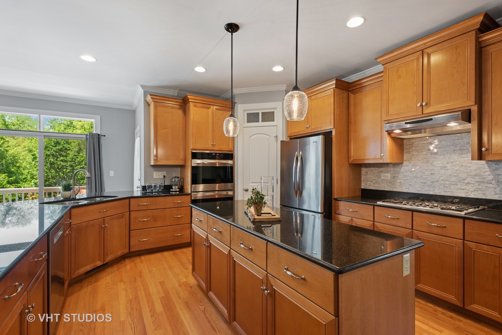 N210 Silverleaf Boulevard Wheaton, IL 60187 - Photo 16 of 48 a kitchen with stainless steel appliances granite countertop a sink a stove and a refrigerator