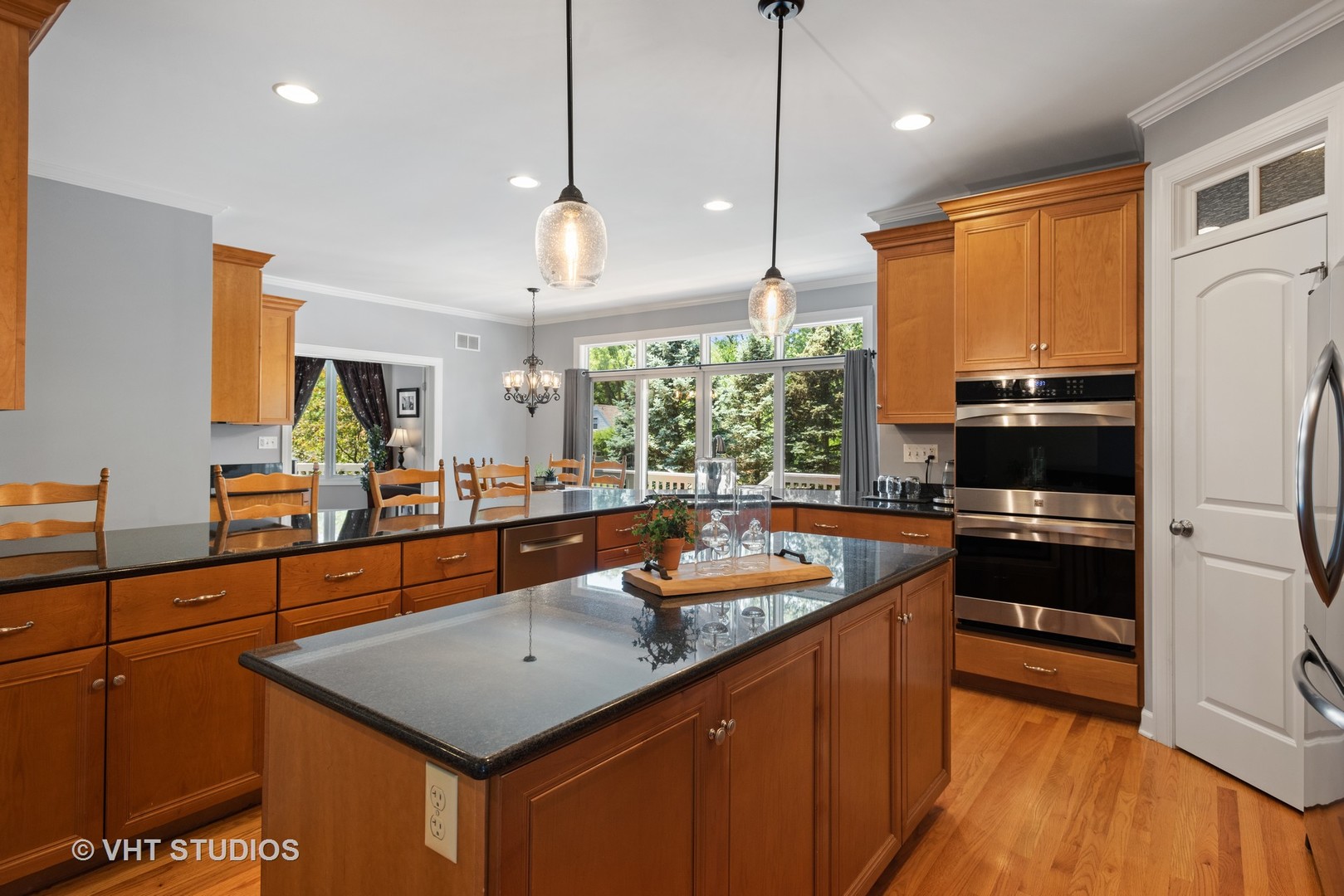 N210 Silverleaf Boulevard Wheaton, IL 60187 - Photo 17 of 48 a kitchen with stainless steel appliances granite countertop a sink a stove and a wooden floors
