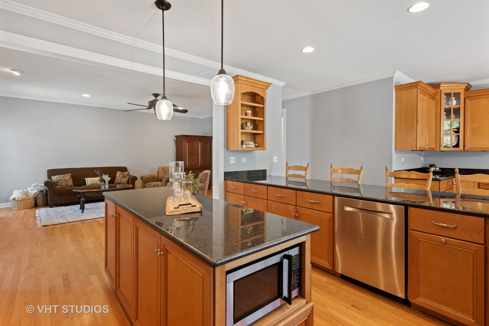N210 Silverleaf Boulevard Wheaton, IL 60187 - Photo 18 of 48 a kitchen with stainless steel appliances granite countertop a sink a stove and a wooden floor