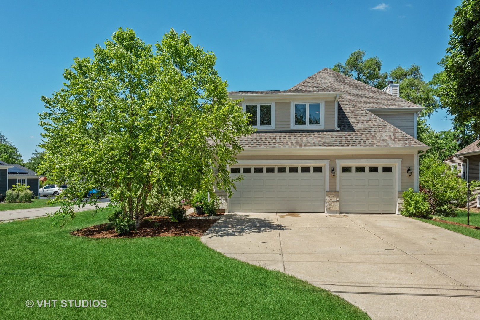 N210 Silverleaf Boulevard Wheaton, IL 60187 - Photo 3 of 48 a house with a tree in front of it
