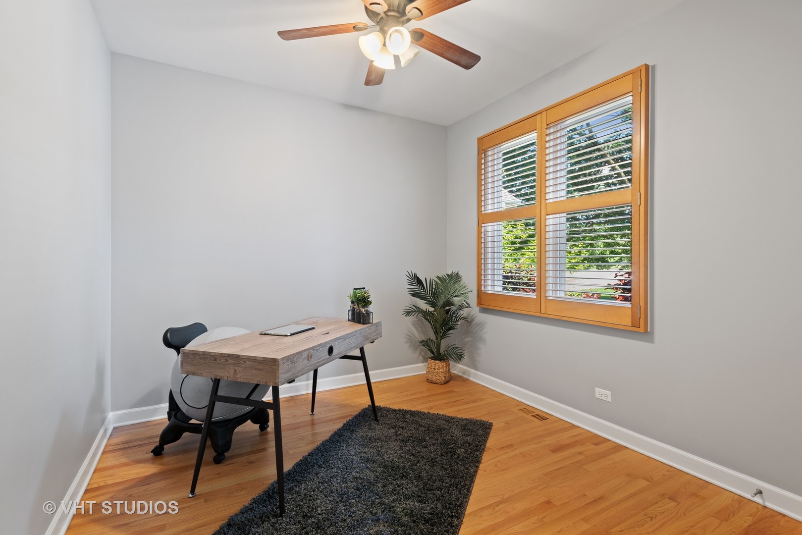 N210 Silverleaf Boulevard Wheaton, IL 60187 - Photo 22 of 48 a bed room with a bed and a window