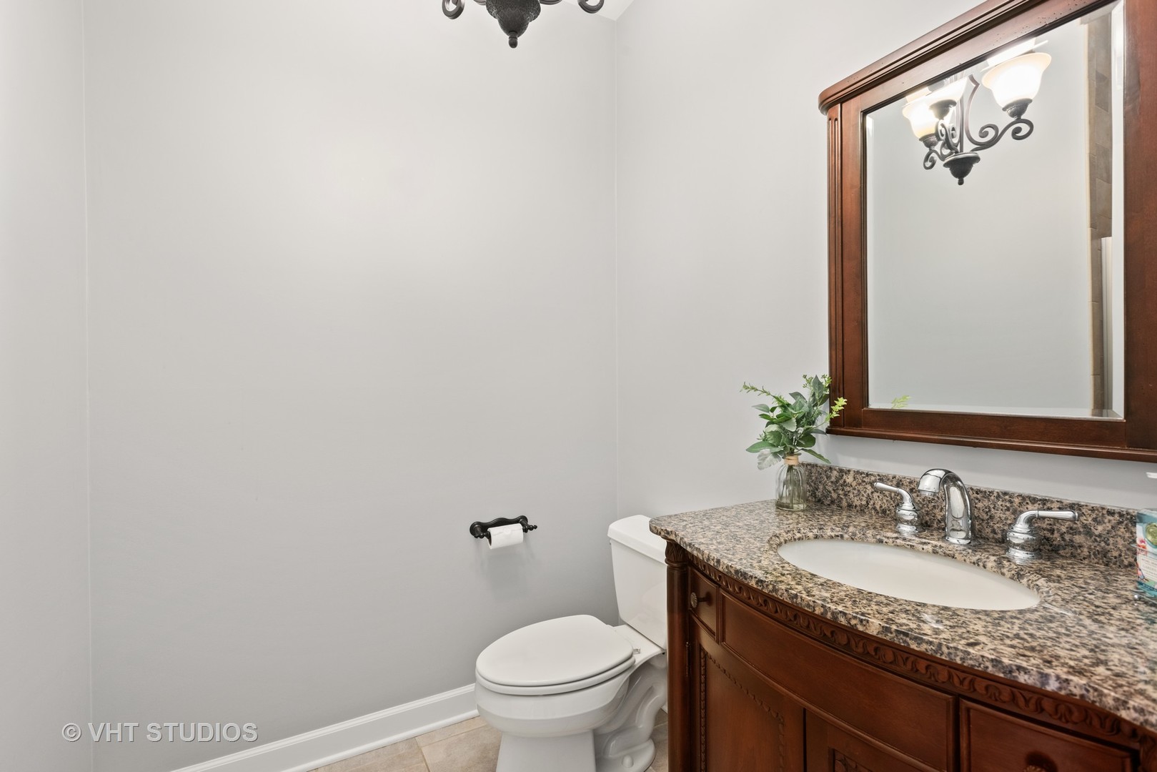 N210 Silverleaf Boulevard Wheaton, IL 60187 - Photo 23 of 48 a bathroom with a granite countertop sink and a mirror