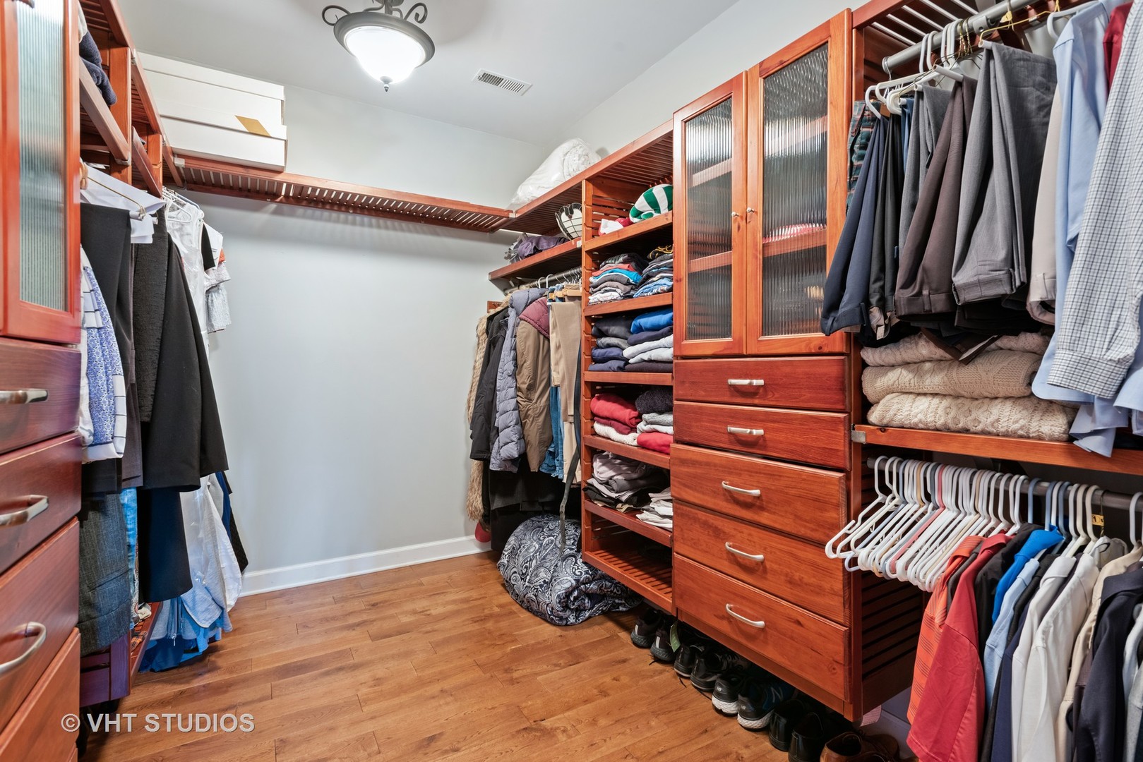 N210 Silverleaf Boulevard Wheaton, IL 60187 - Photo 27 of 48 a view of walk in closet with clothes and shoes