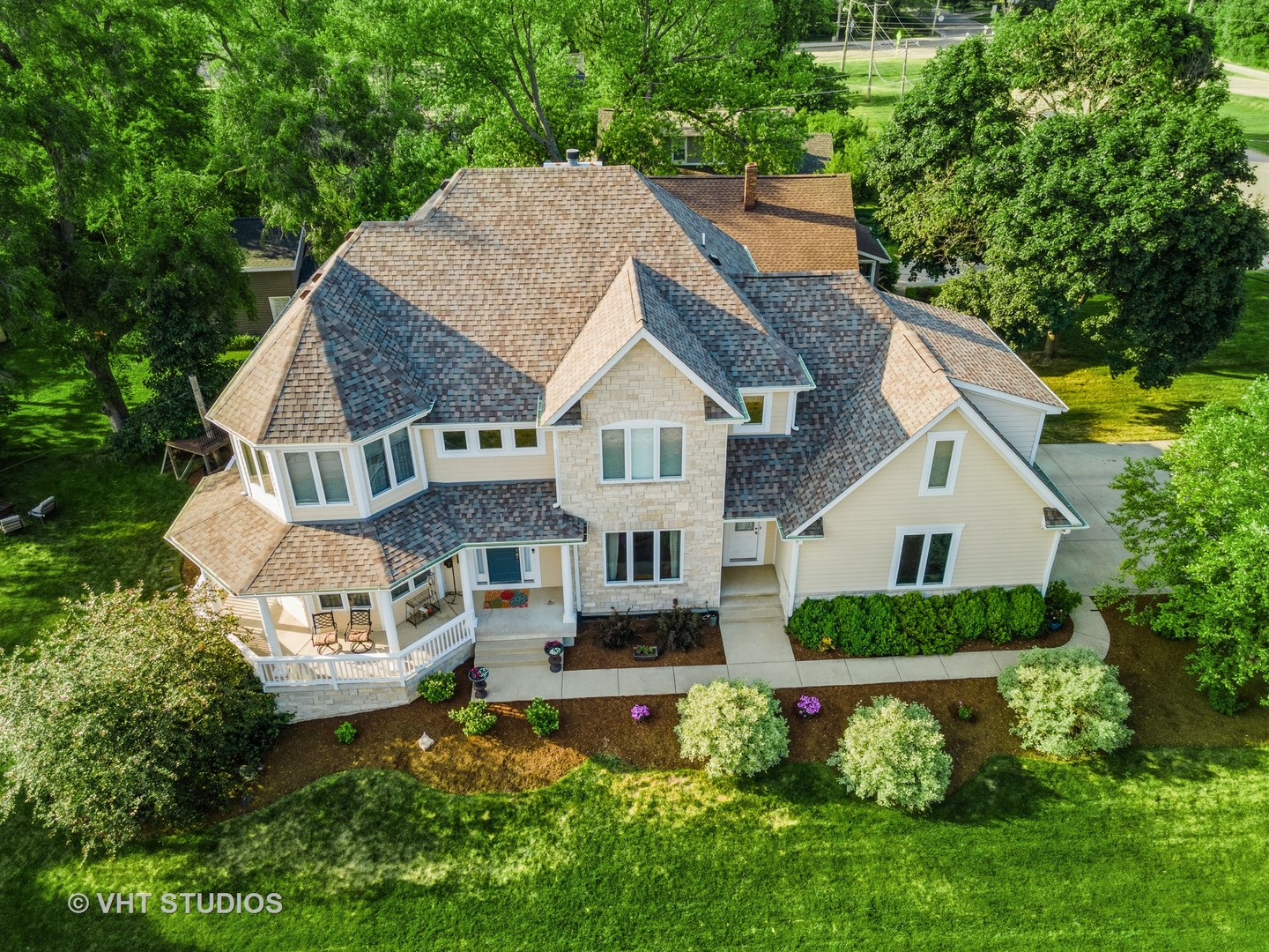 N210 Silverleaf Boulevard Wheaton, IL 60187 - Photo 4 of 48 a aerial view of a house with a yard and potted plants