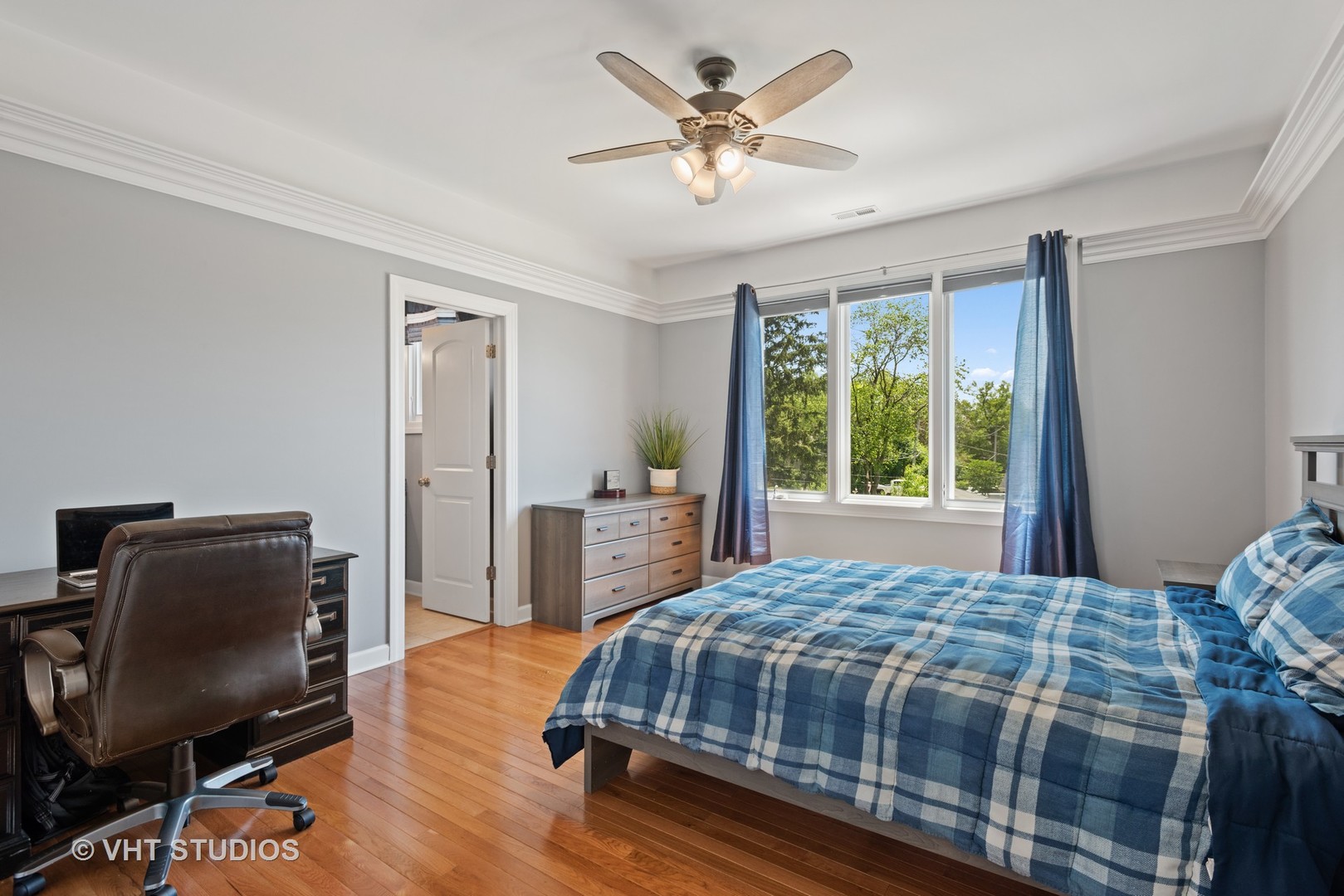 N210 Silverleaf Boulevard Wheaton, IL 60187 - Photo 31 of 48 a bedroom with a bed a chair and a large window