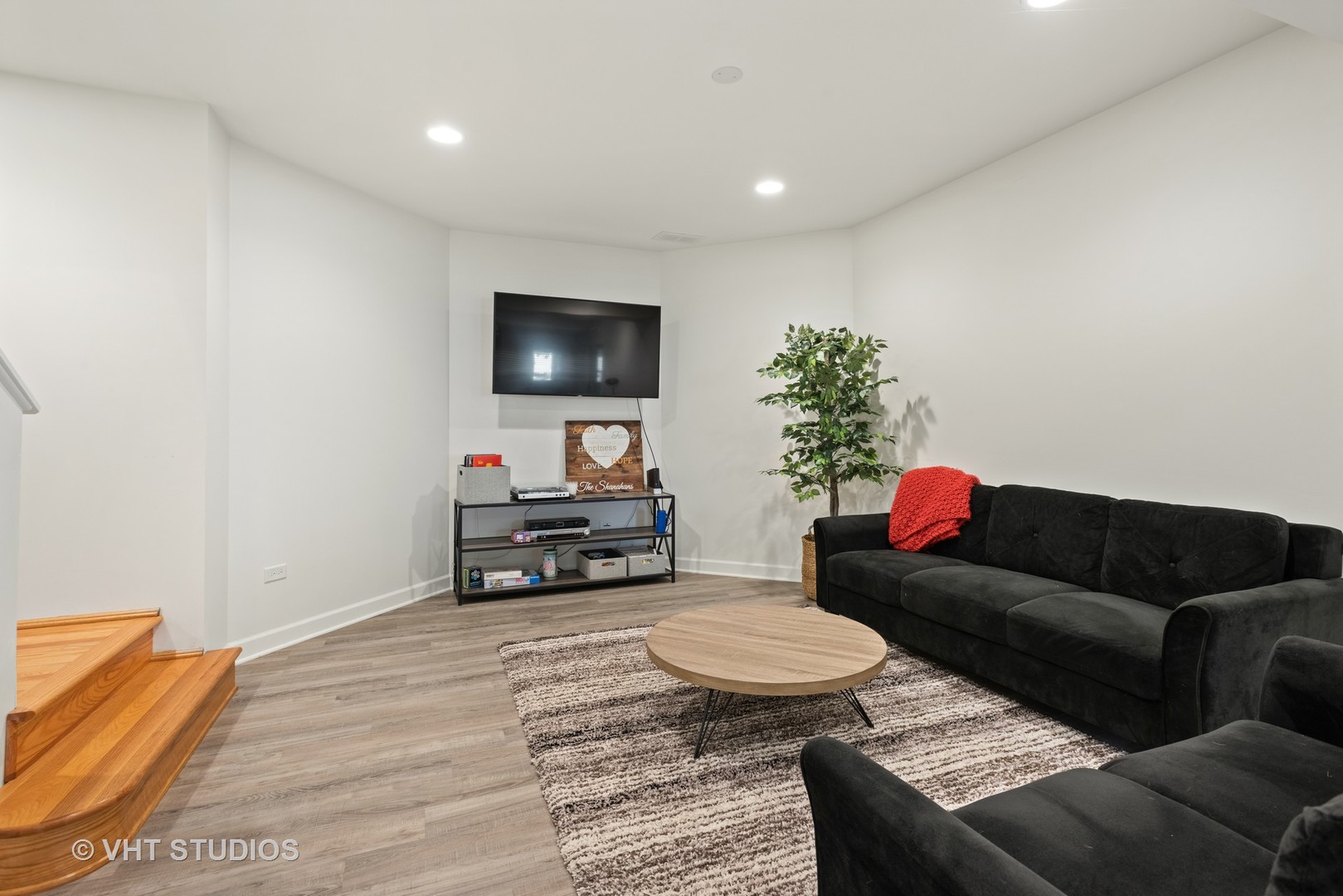 N210 Silverleaf Boulevard Wheaton, IL 60187 - Photo 37 of 48 a living room with furniture and a flat screen tv