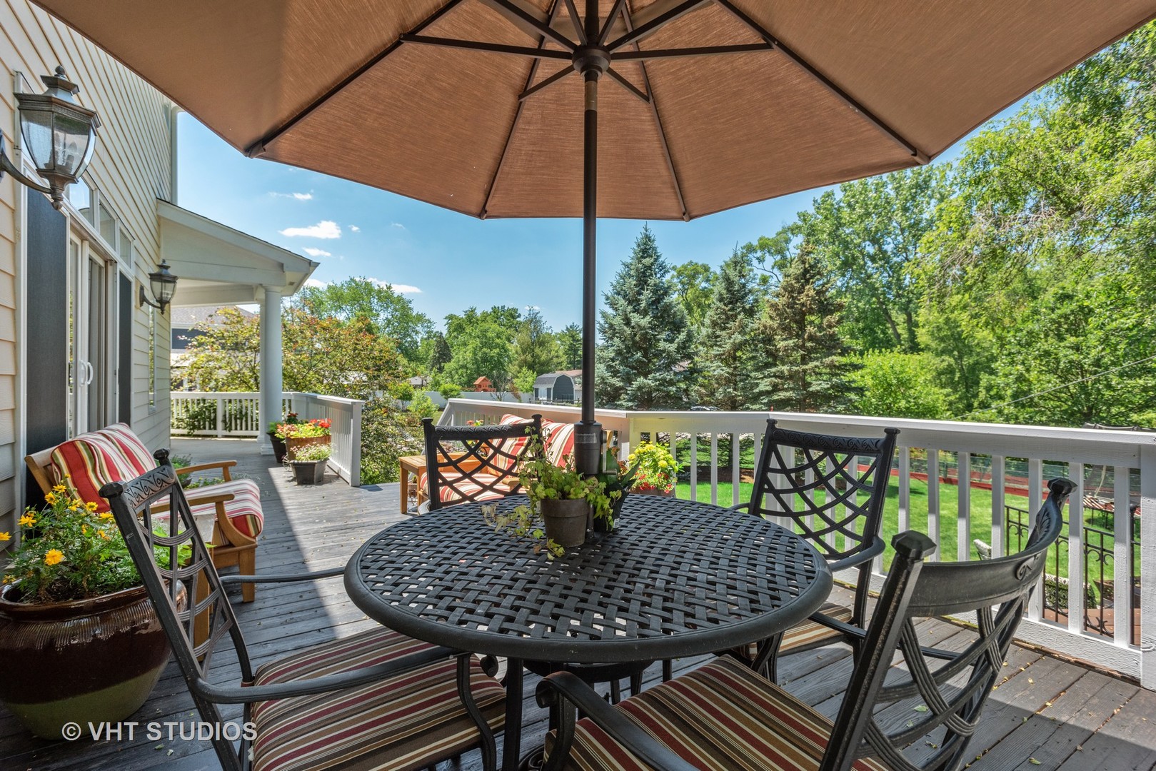 N210 Silverleaf Boulevard Wheaton, IL 60187 - Photo 41 of 48 a view of balcony with furniture and umbrella