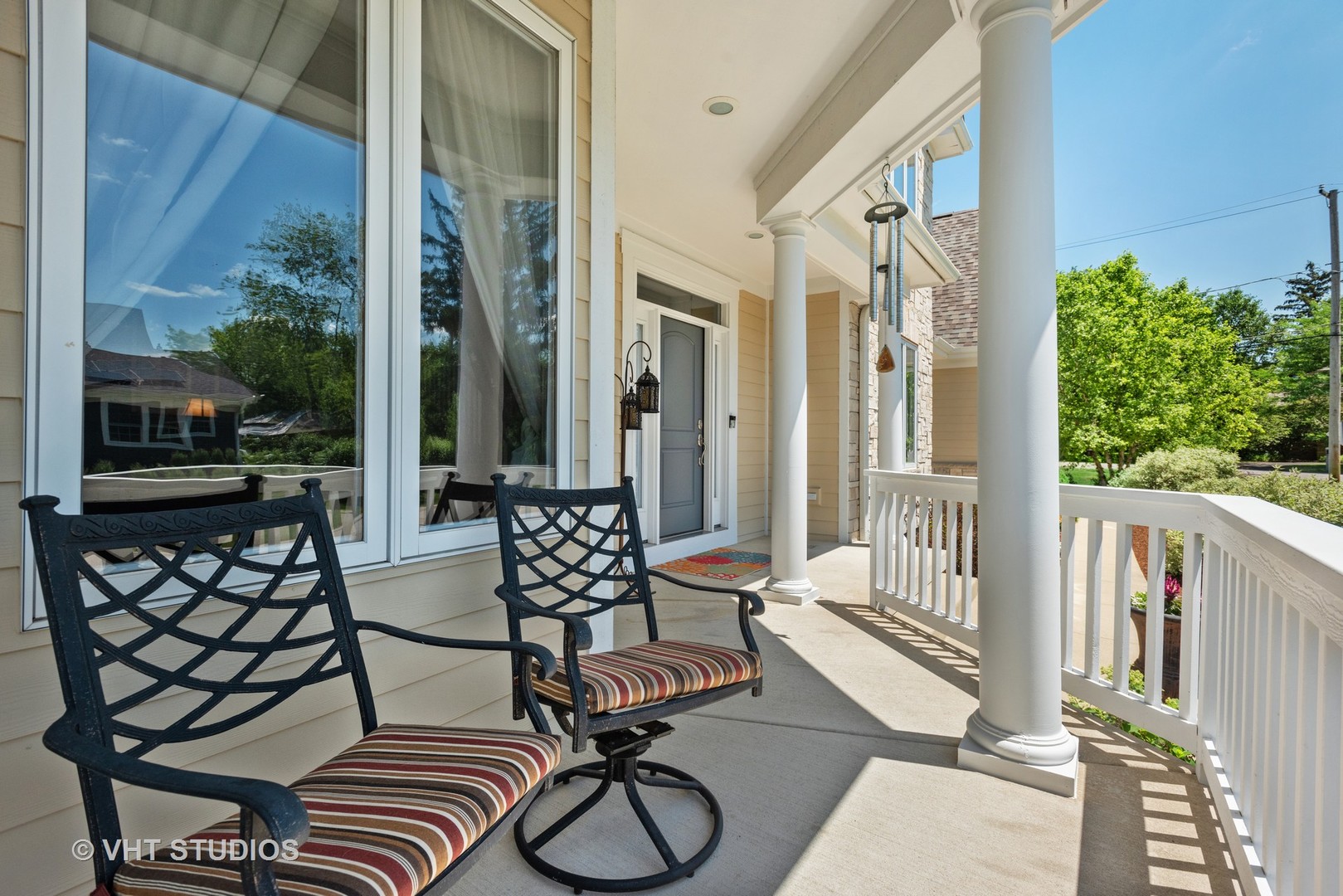 N210 Silverleaf Boulevard Wheaton, IL 60187 - Photo 8 of 48 a view of a balcony with chairs