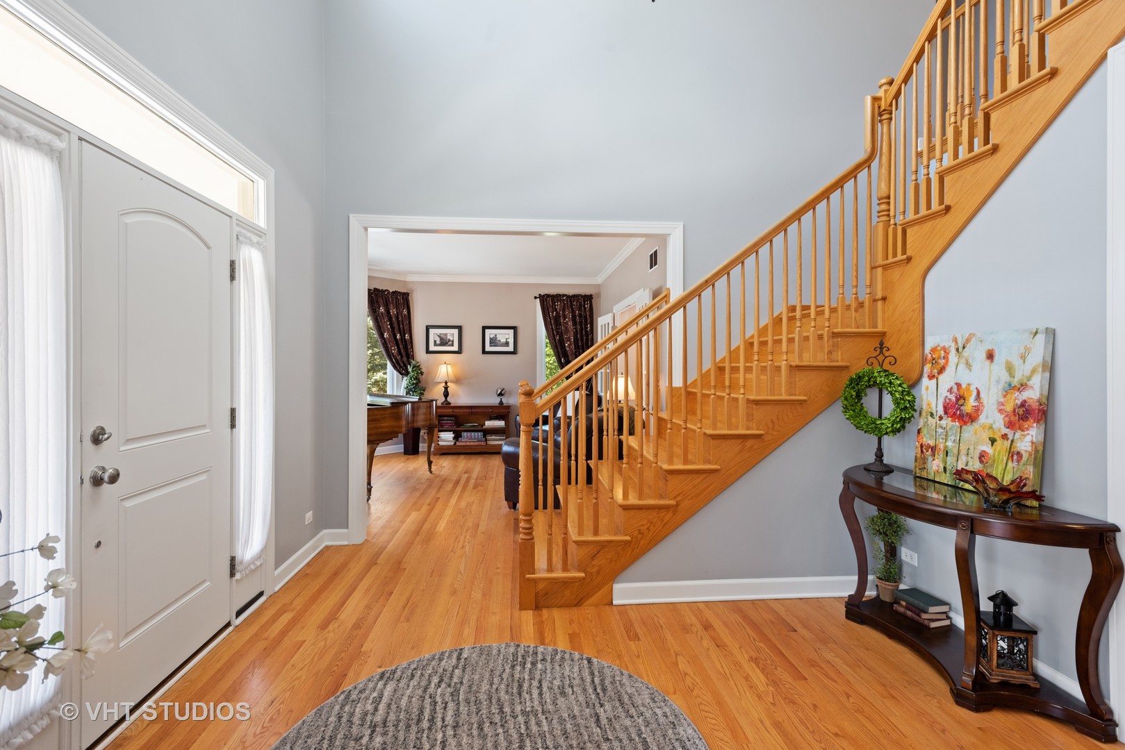 N210 Silverleaf Boulevard Wheaton, IL 60187 - Photo 9 of 48 a view of a livingroom with wooden floor and furniture