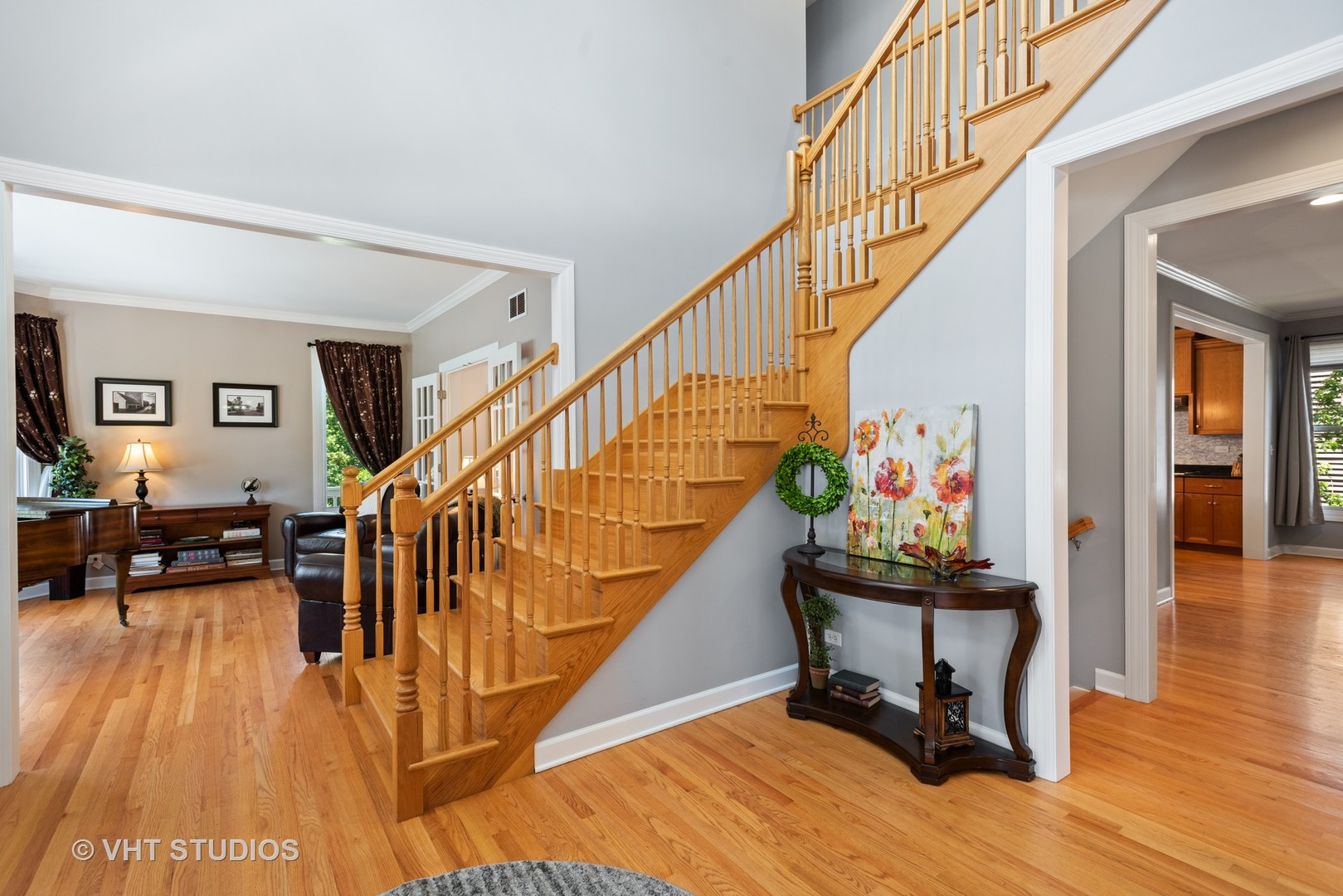 N210 Silverleaf Boulevard Wheaton, IL 60187 - Photo 10 of 48 a dining room with wooden floor and stairs