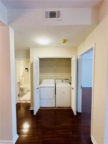 a view of utility room with wooden floor