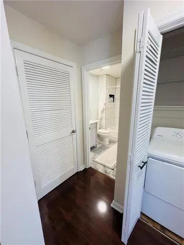 a view of a bathroom from a hallway