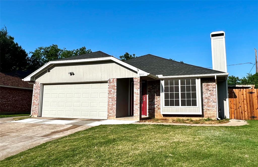5207 Cornvalley Drive Arlington, TX 76017 - Photo 1 of 1 a front view of a house with a garden