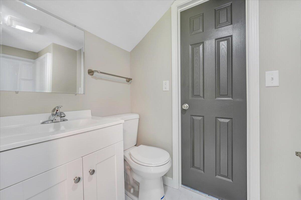 350 Mills Road Callaway, VA 24067 - Photo 21 of 45 a bathroom with a toilet a sink a vanity and mirror