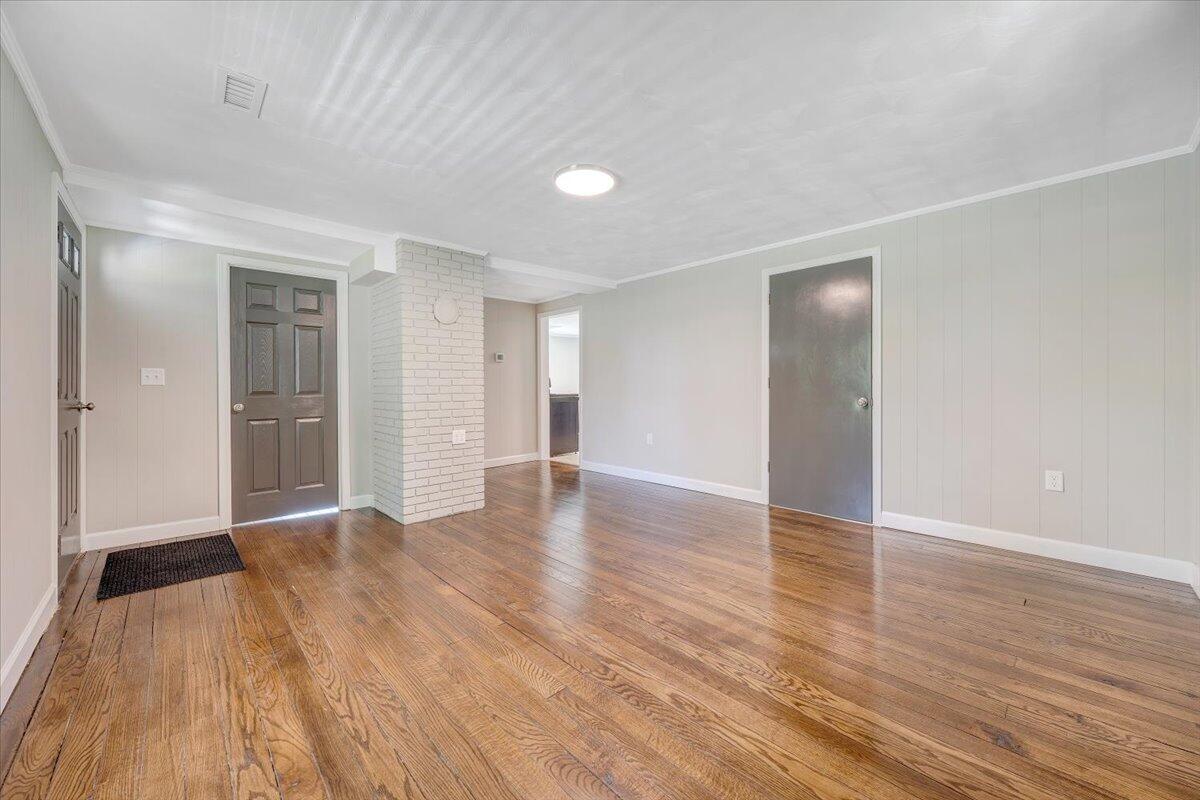 350 Mills Road Callaway, VA 24067 - Photo 3 of 45 a view of an empty room with wooden floor