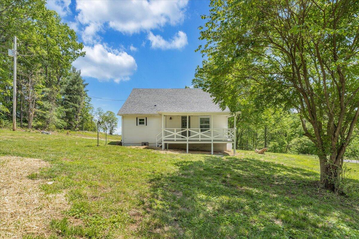 350 Mills Road Callaway, VA 24067 - Photo 31 of 45 a view of a house with a big yard and large trees
