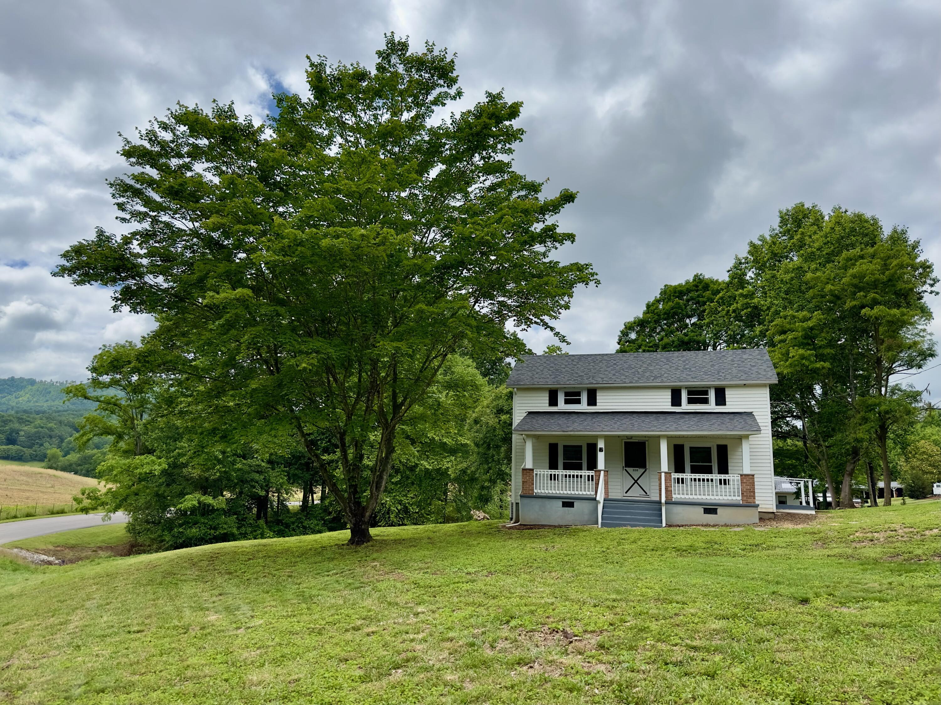 350 Mills Road Callaway, VA 24067 - Photo 44 of 45 a front view of a house with a garden