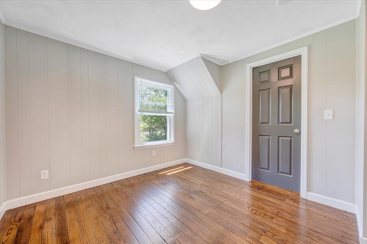350 Mills Road Callaway, VA 24067 - Photo 5 of 45 an empty room with wooden floor and windows