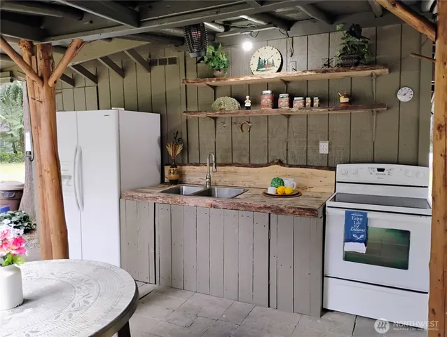 a view of kitchen with wooden floor