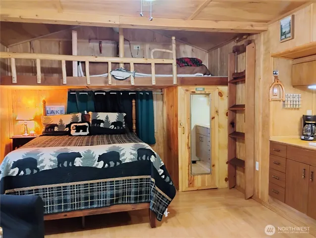 a bed room with a bed and a window