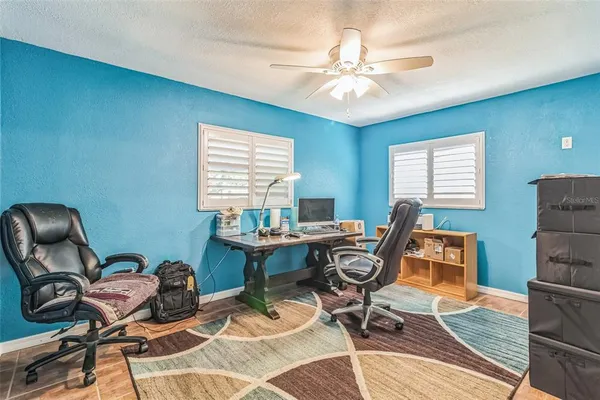 a workspace with furniture and a chandelier