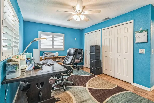 a work room with furniture and a window