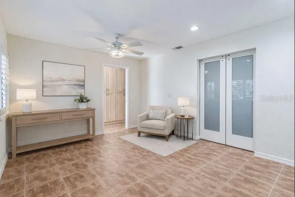a spacious bedroom with a bed and furniture