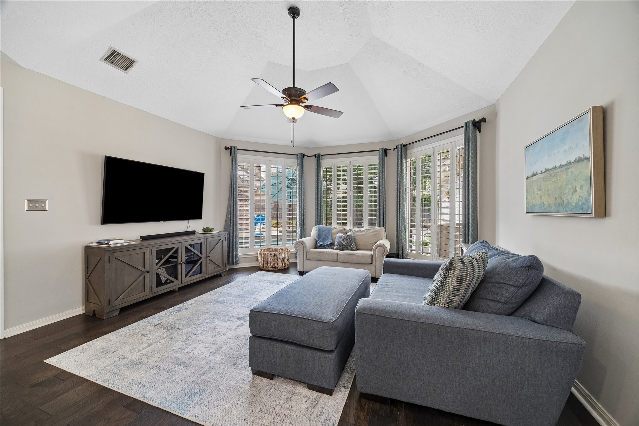 2810 Timber Country Way Kingwood, TX 77345 - Photo 12 of 30 a living room with furniture and a flat screen tv