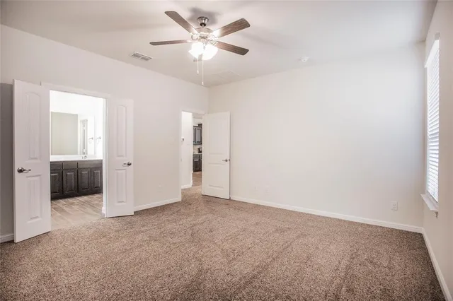 an empty room with a bathroom