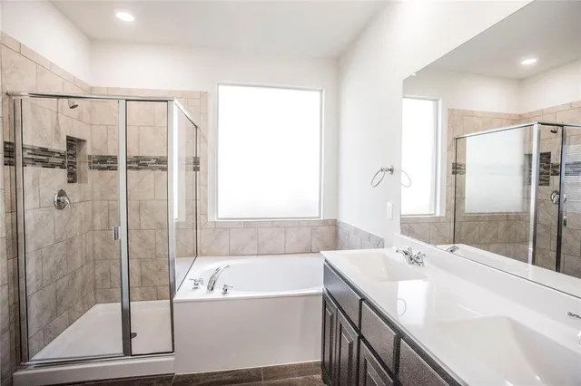 a bathroom with a bathtub and a sink