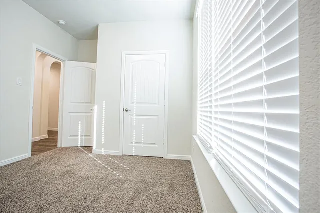 a view of room with window and stairs