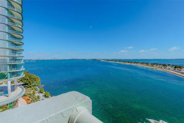 a view of a dining room with furniture and window