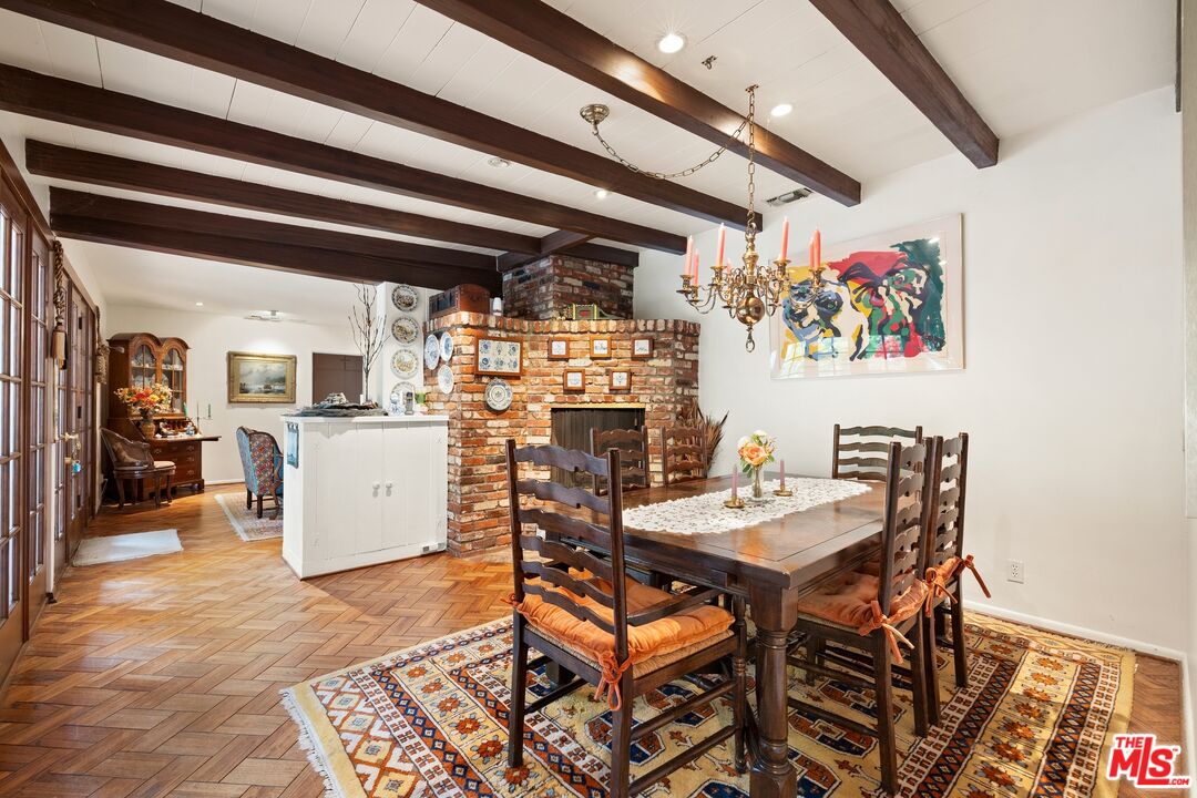 1444 Roscomare Road Los Angeles, CA 90077 - Photo 4 of 19 a view of a dining room with furniture and a kitchen