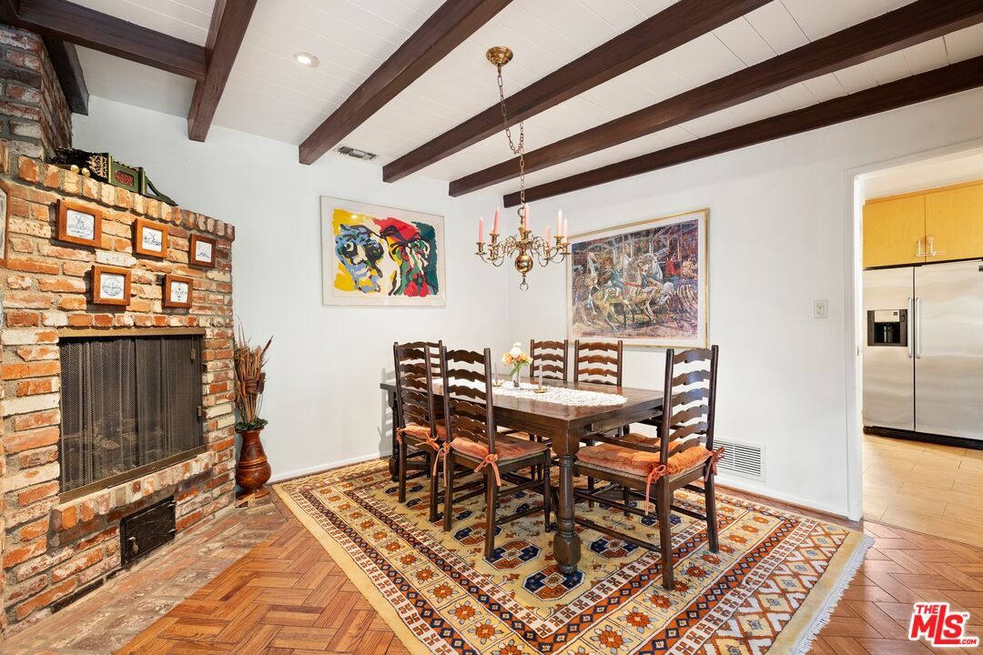 1444 Roscomare Road Los Angeles, CA 90077 - Photo 5 of 19 a view of a dining room with furniture