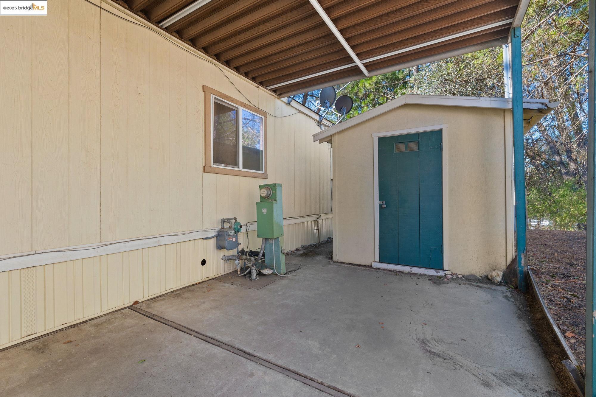 10956 Green Street, Unit 186 Columbia, CA 95310 - Photo 19 of 21 View of patio / terrace with a shed
