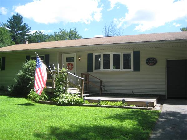 98 Adams Road Grafton, MA 01536 - Photo 1 of 15 a front view of a house with a yard