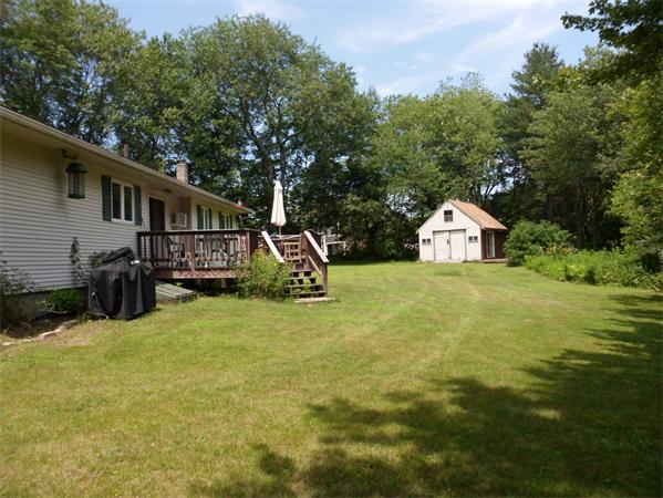 98 Adams Road Grafton, MA 01536 - Photo 13 of 15 a view of a house with backyard and sitting area