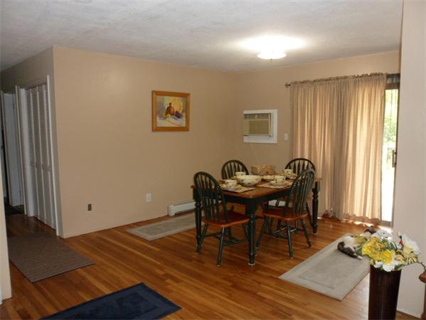 98 Adams Road Grafton, MA 01536 - Photo 6 of 15 a view of a dining room with furniture and window