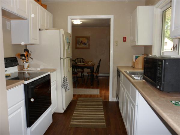 98 Adams Road Grafton, MA 01536 - Photo 7 of 15 a kitchen with stainless steel appliances a refrigerator and a stove top oven