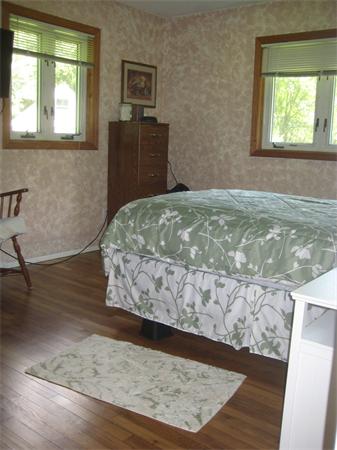 98 Adams Road Grafton, MA 01536 - Photo 10 of 15 a bed sitting in a bedroom next to a window