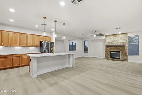 a kitchen with granite countertop cabinets stainless steel appliances and a sink
