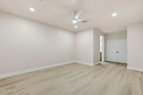 a bathroom with a toilet a sink and a mirror