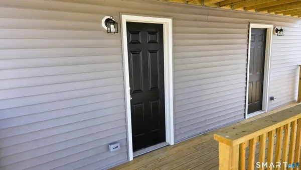 a view of balcony with wooden floor