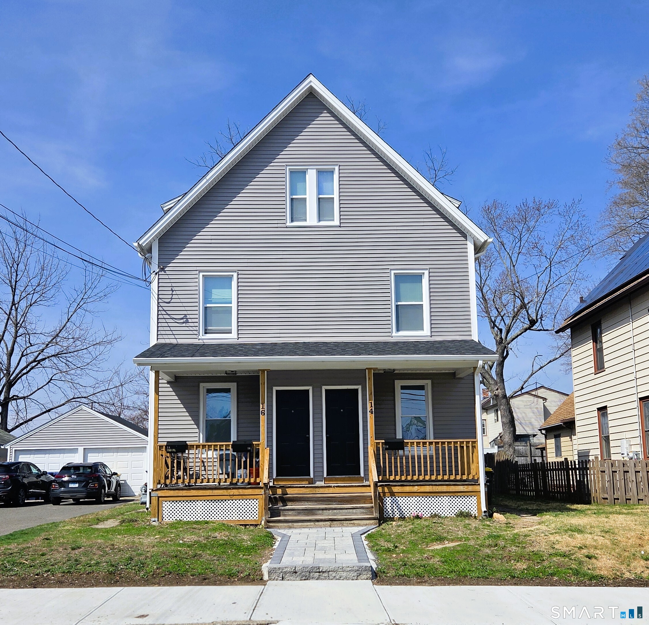 14 Meadow Street Ansonia, CT 06401 - Photo 2 of 25 a front view of a house with a yard