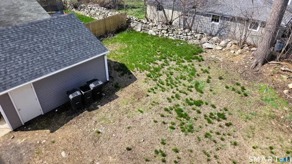 a view of a car parked in front of a house
