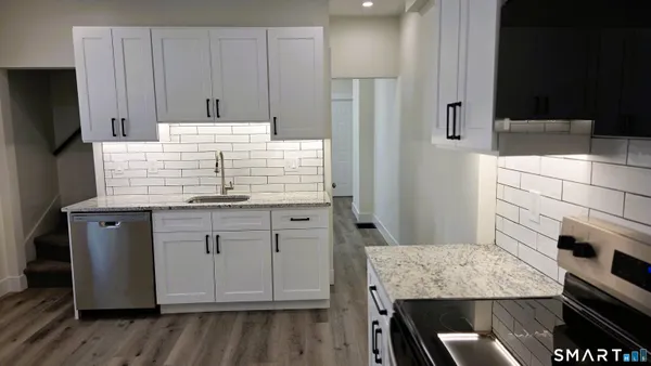 a kitchen with kitchen island cabinets and refrigerator