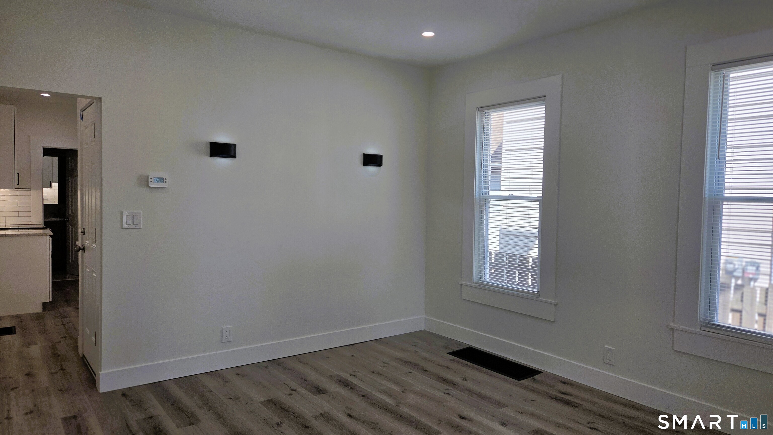 14 Meadow Street Ansonia, CT 06401 - Photo 8 of 25 an empty room with windows