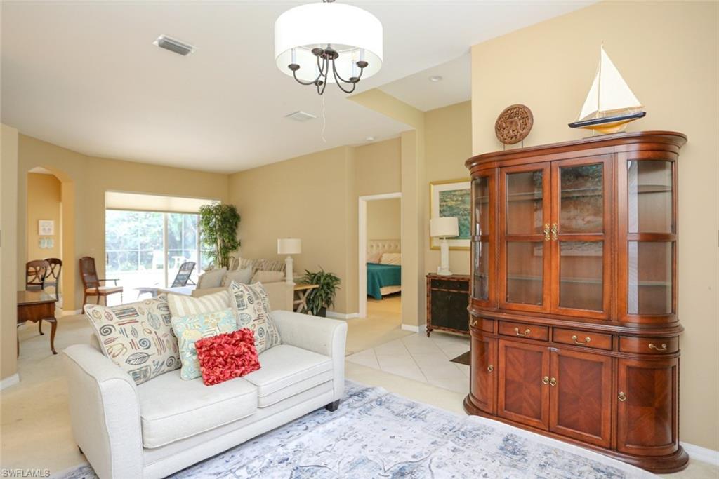 164 Spring Lake Circle Naples, FL 34119 - Photo 11 of 36 a living room with furniture
