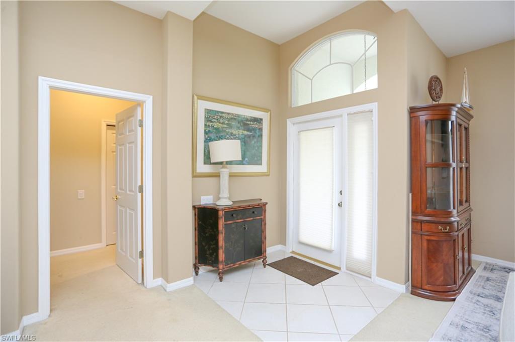 164 Spring Lake Circle Naples, FL 34119 - Photo 9 of 36 a view of kitchen with stainless steel appliances granite countertop a refrigerator and a sink